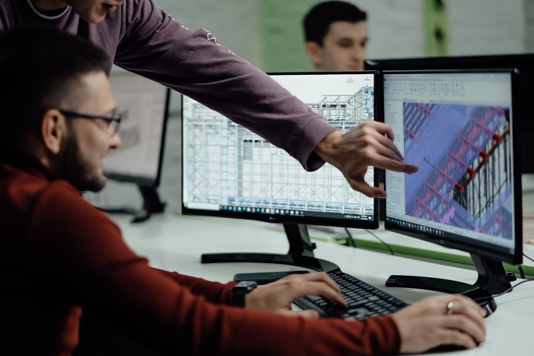colleagues-collaborate-while-examining-computer-designs-vfmhqkil6e4