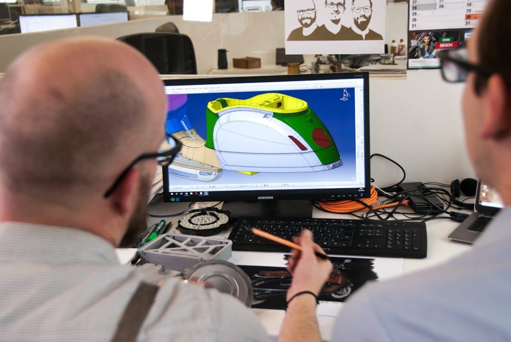 Man using a CAD tool to design the electric scooter Kumpan 1954 Ri.